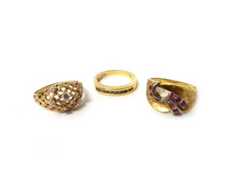 An 18ct gold and diamond ring, mounted with a row of nine circular cut diamonds, a gold and ruby set ring, with a spray motif