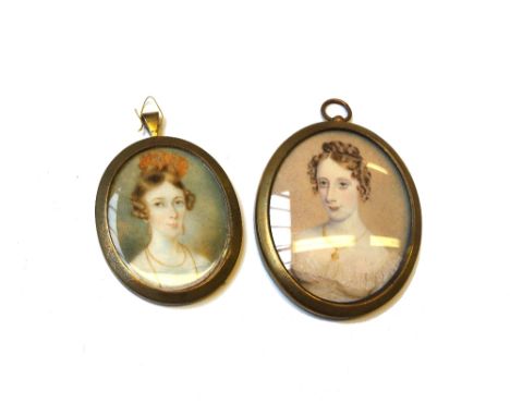 A Victorian portrait miniature on ivory of a young woman with coral coloured hair decoration, earrings and necklace, 5cm high