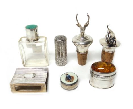 A silver topped and green enamelled glass scent bottle, a Victorian silver cased cylindrical smelling salts bottle, with engr