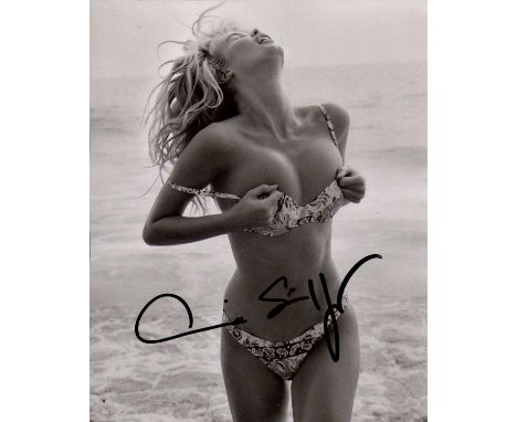 SCHIFFER CLAUDIA: (1970- ) German Model and fashion Designer. Schiffer holds the record with the most magazine covers appeara