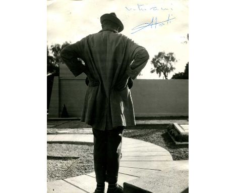TATI JACQUES: (1907-1982) French mime artist, actor and film director. A good vintage signed 7 x 9.5 photograph of Tati stand