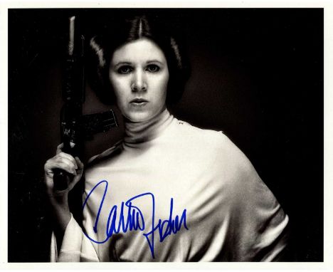 FISHER CARRIE: (1956-2016) American actress. Signed 10 x 8 photograph of Fisher standing in a half-length pose in costume fro