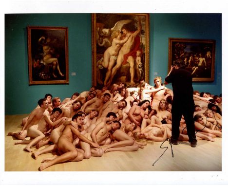 TUNICK SPENCER: (1967- ) American photographer. Signed colour 10 x 8 photograph of Tunick standing in a full-length pose as h
