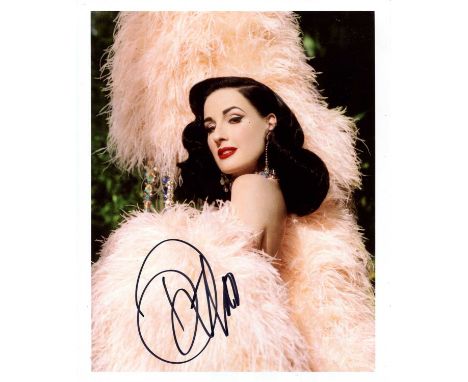 VON TEESE DITA: (1972- ) American vedette, burlesque dancer and model. Signed colour 8 x 10 photograph of Von Teese in a head