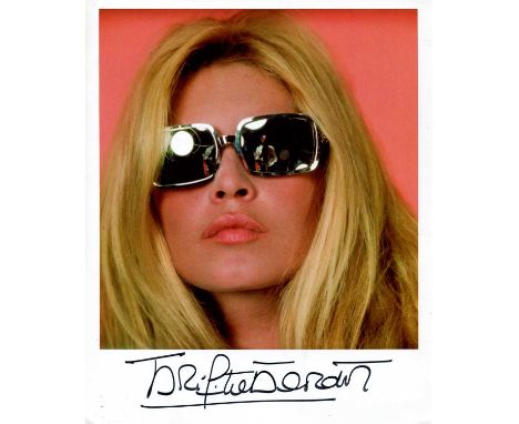 BARDOT BRIGITTE: (1934- ) French actress and sex symbol. Signed colour 8 x 10 photograph, a close-up portrait study of the ac