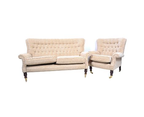 Three piece lounge suite, comprising two seat sofa and two matching armchairs on turned mahogany effect supports with brass c