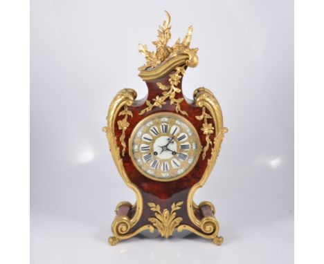 Stained wood tortoiseshell effect and gilt metal garniture, comprising balloon shaped clock, circular enamelled dial, signed 
