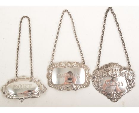 Silver decanter label, 'Whisky', embossed with a cherub mask, two other labels, 'Port' and 'Madeira', 1.3oz (3)