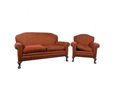 Four piece lounge suite, comprising two seat sofa,  two matching armchairs, and a matching footstool, on carved claw and ball