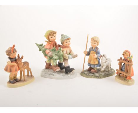 Collection of Goebel figurines, and two Berta Hummel groups. (10)