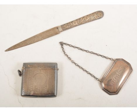 Silver engined turned vesta, letter knife with filigree handle, and a 'Whisky' decanter label, 1.5oz (3)