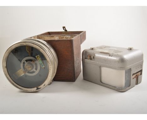 Three pigeon clocks, two by The Automatic Timing Clock Company Ltd, in oak carry cases.