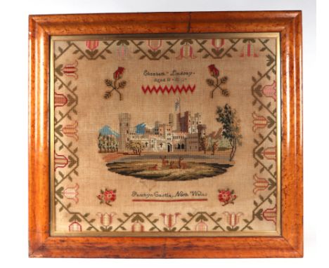 A large Victorian woolwork sampler - Penrhyn Castle North Wales by Elizabeth Lindsay aged 11 within a foliate border, glazed 