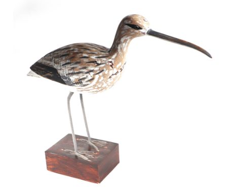 In the manner of Guy Taplin - a carved and painted wooden model of a wading bird, 32cms high.
