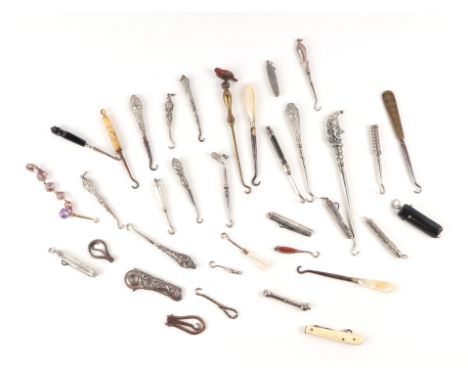 A quantity of miniature button hooks to include novelty examples, Mr Punch, Golf Club, Chatelain and silver handled examples.