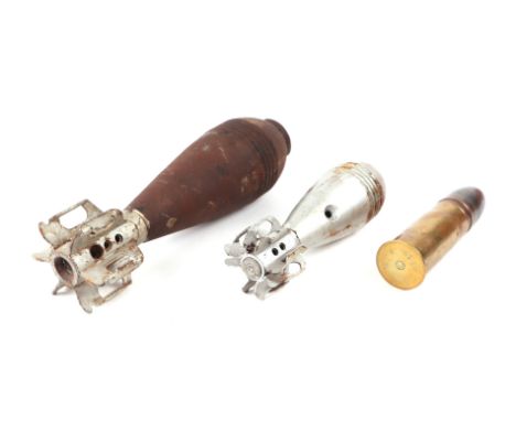 Inert Military Ordnance: A WW1 artillery shell in two parts with an overall length of 16cms (6.25ins), together with two bomb