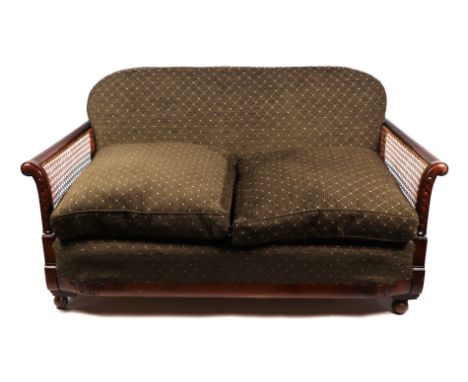 An early 20th century upholstered two seater bergere sofa, 150cms wide.