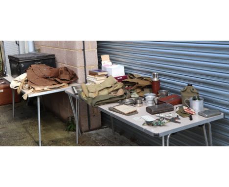 A large quantity of militaria in a tin trunk named to 'M C Barrett' to include hip flasks, canvas bags, model planes, and a s