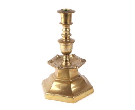 A Flemish 17th century style brass candlestick, 22cms high.
