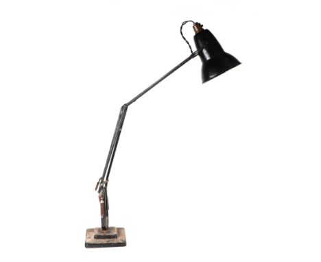 A Herbert Terry Anglepoise lamp on a square two-step base.
