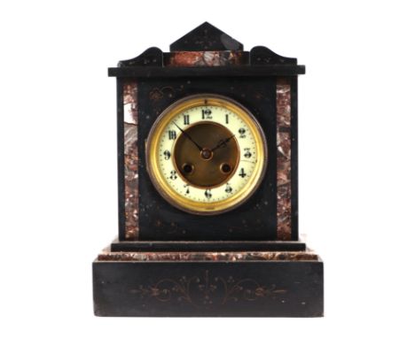 A Victorian black slate mantle clock with rouge marble inlay,the enamel chapter ring with Arabic numerals, fitted with an 8-d