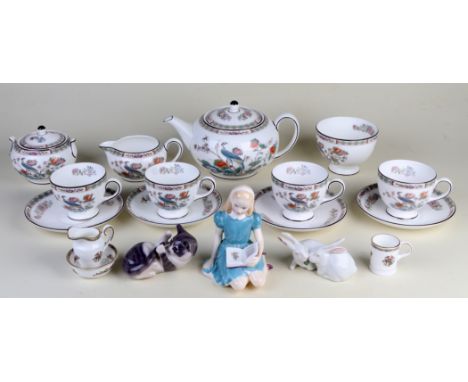 A Royal Worcester Kutani Crane pattern four-person tea service; together with a Coalport miniature jug & bowl set and a match