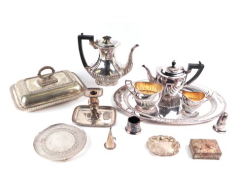 A quantity of assorted silver plated items to include a chamberstick, entree dish and cover, tea service, tray and other simi