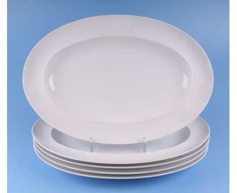 A set of five Richard Ginori oval platters decorated with a fish and trident, each 48cms wide (5).