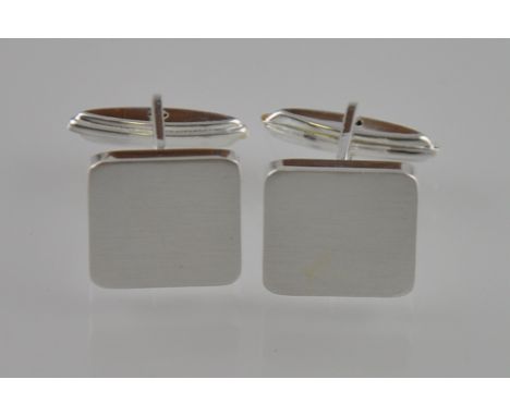 A set of silver plain flat satin finish cufflinks with a bar and swivel setting