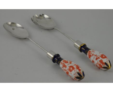 A pair of Edwardian silver salad servers with Imari pattern porcelain handles, hallmarked London 1909 by Army & Navy