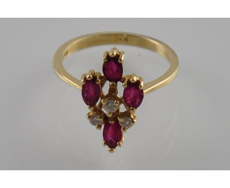 A ruby and diamond dress ring asymmetrically set in a 14ct yellow gold band