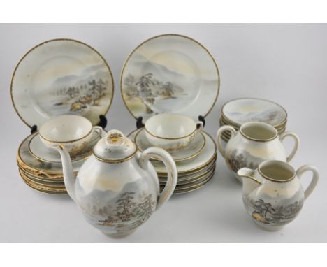 A Japanese porcelain twenty-eight piece part tea service, decorated with landscape scenes on an ivory ground, comprising teap