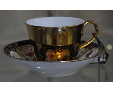 Richard Brendon, a boxed gilt porcelain standard cup with 19th Century Spode style saucer