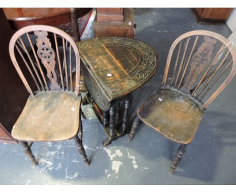 A small 1920's oak gateleg table together with an oak standard lamp and shade and a pair of wheel back dining chairs