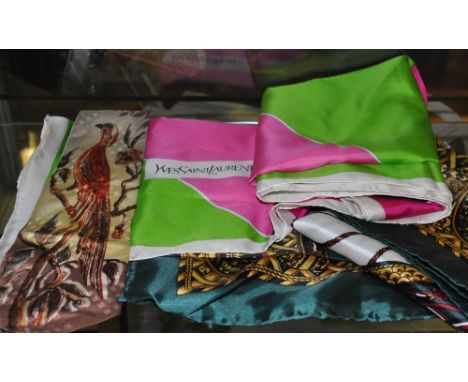 Silk scarf marked 'Hermes Paris 1994' together with a Yve Saint Laurent scarf designed with bold geometric pattern and a hand