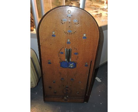 A vintage bagatelle board, a Pelham puppet, assorted other puppets, and a vintage case