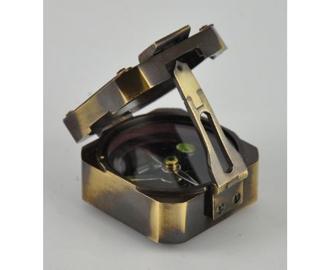A brass military compass with crown