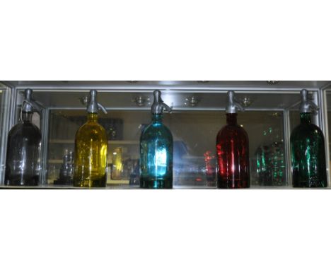 A set of five vintage style coloured glass bottles modelled as soda syphons