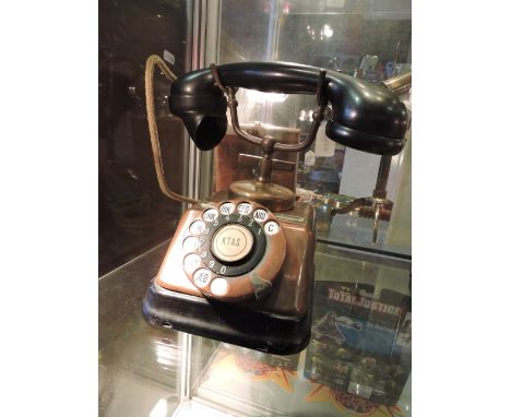 A bronzed vintage style telephone