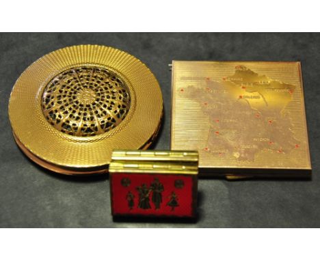 A vintage gilt metal circular powder compact, together with a compact showing a map of France, and a small red folding pictur