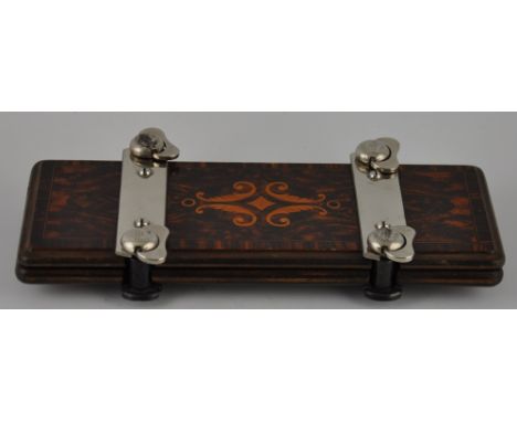 A 1930's bowtie/tie press by Agrippa, the top with marquetry inlay (may also be used to press flowers!)