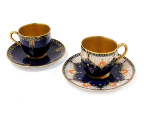 A Royal Worcester porcelain coffee cup and saucer, circa 1926, painted by R Austin, with a peacock and pine cones, two furthe