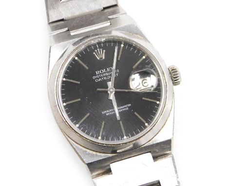 A Rolex gentleman's Oysterquartz Datejust stainless steel wristwatch, the circular black dial, with centre seconds, date aper