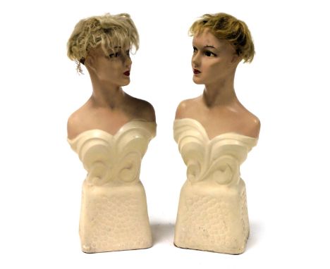 A pair of vintage mid century plaster mannequins, modelled as the bust of a lady, one facing left, the other right, on a plin