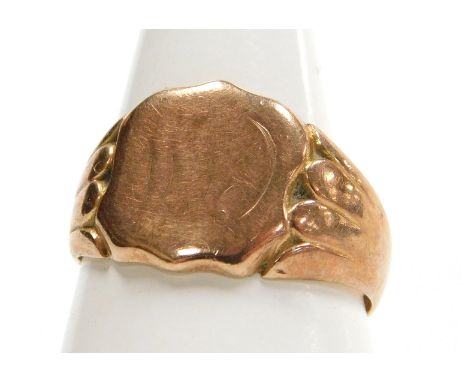 A 9ct rose gold shield shaped signet ring, monogram engraved, size Q½, 5.4g. 