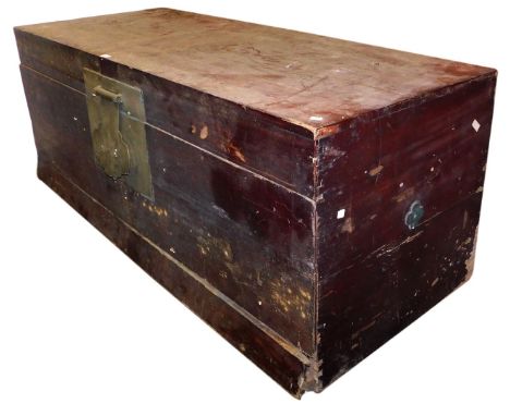 A Chinese hardwood trunk, with a brass lock plate, 61cm high, 157cm wide, 63cm deep. 