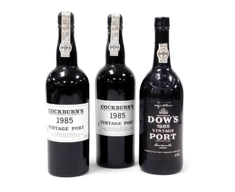 Two bottles of Cockburn's vintage port 1985, together with a bottle of Dow's vintage port 1985. (3) 