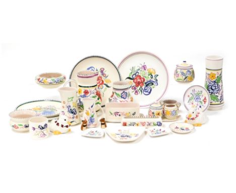 A group of Poole pottery, traditional painted with flowers, including plates, vases, jugs, preserve pot, condiments and small
