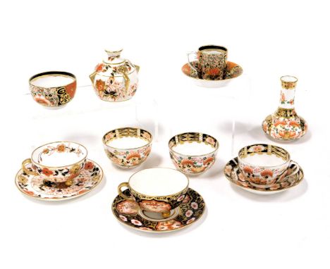 A group of Derby Stevenson and Hancock porcelain Imari tea and coffee wares, together with a spill vase, two Davenport Imari 