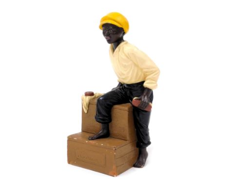 A French advertising ceramic of a shoe shine boy. Marked Cireur to front. Approx 22cm high